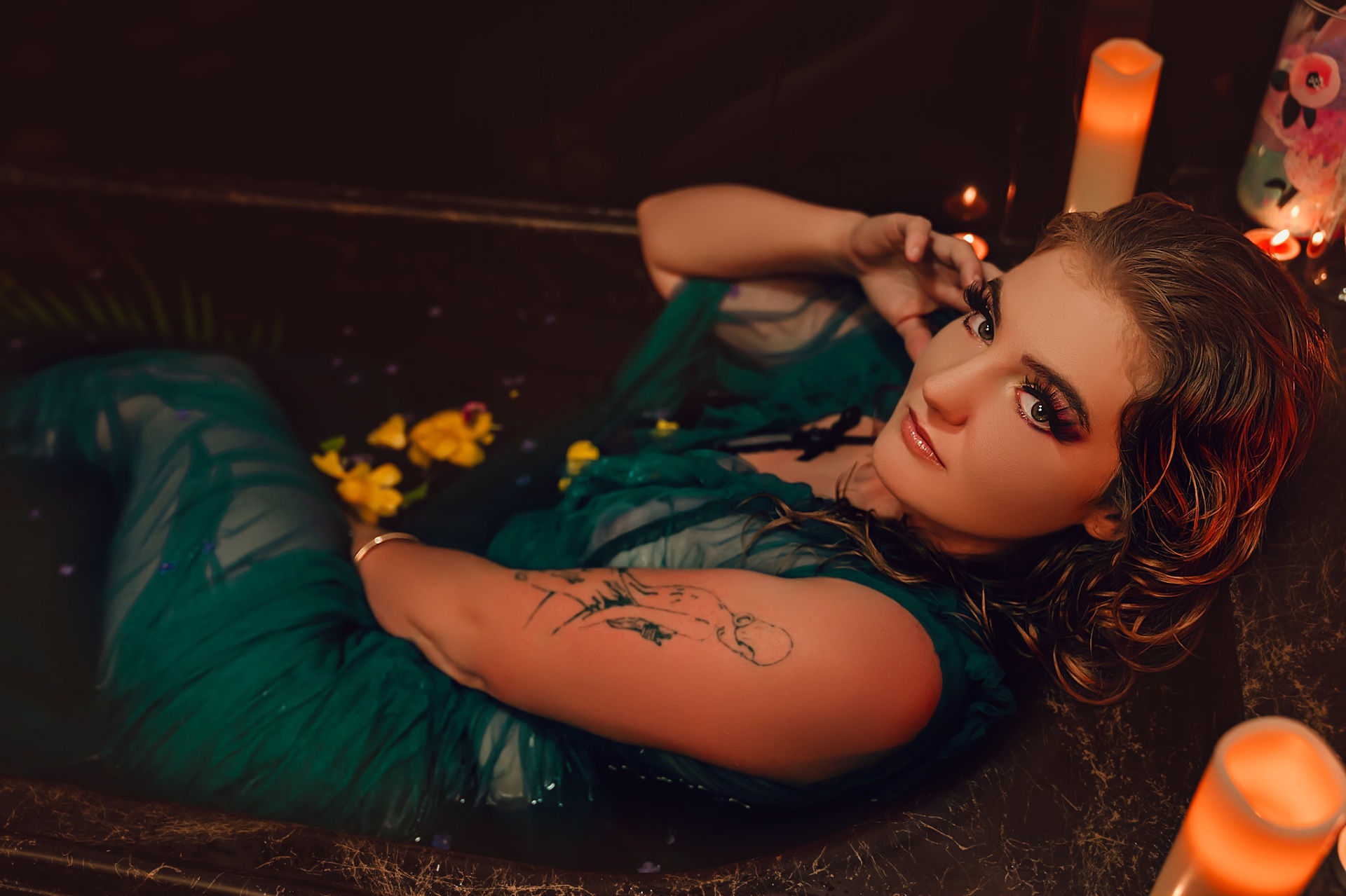 Boudoir portrait in a candlelit bath